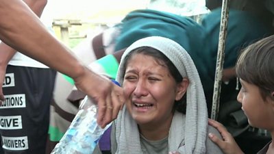 A woman at Greece's Moria refugee camp cries after police fired tear gas