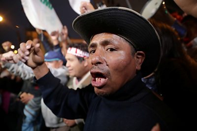 A supporter of President Vizcarra demonstrates outside of Congress