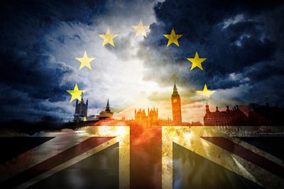 Westminster skyline and UK amd EU flags