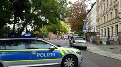 A German police car blocks a closed-off road