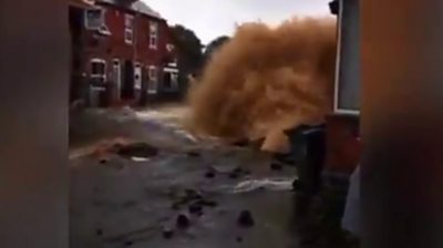 Burst pipe's water gushes high into the air