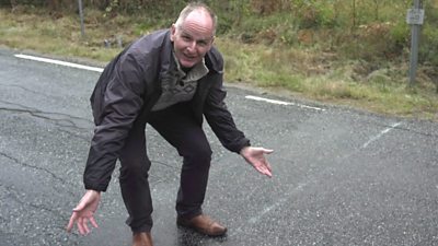 A faint line in the road marking the Norway-Sweden border