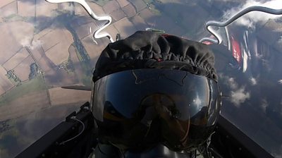 A pilot in a cockpit