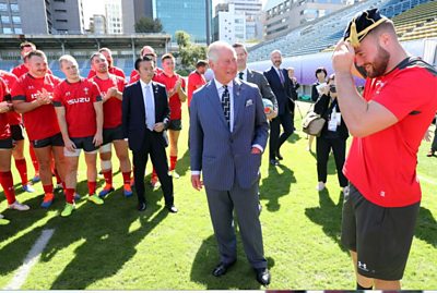 Prince Charles meets Owen Lane to give him his World Cup cap