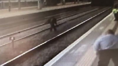 CCTV shows the 40-year-old throwing objects and shouting abuse at staff at a busy station.