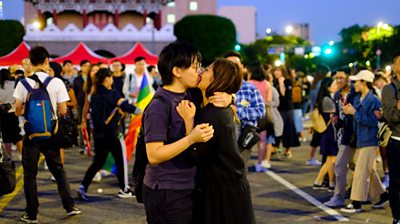 Lesbian couple celebrate Pride with kiss