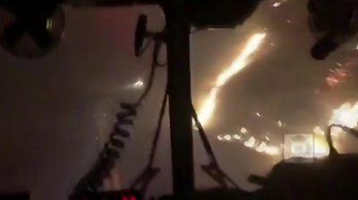 The San Francisco Fire Department tackle the Kincade Fire overnight in northern California.