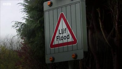 Flooding road sign