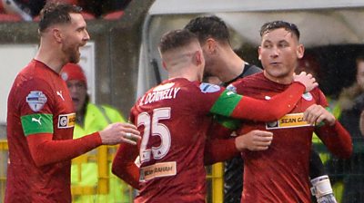 Cliftonville's Conor McDermott celebrates with team mates