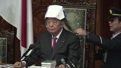 Speaker of the House of Representatives puts on a helmet