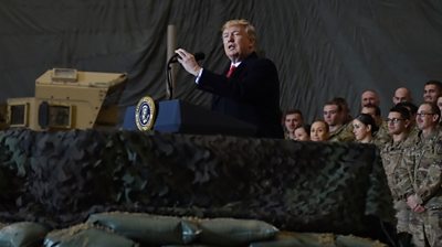 US President Donald Trump speaks to the troops during a surprise Thanksgiving day visit at Bagram Air Field