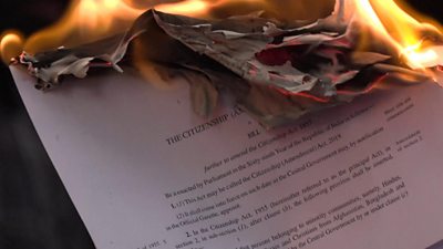 Protesters set fire to copies of the new citizenship bill