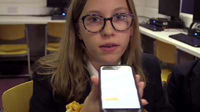 A school child using an app which transcribes speech
