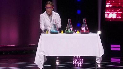 Camille Schrier conducted a chemistry demonstration on stage