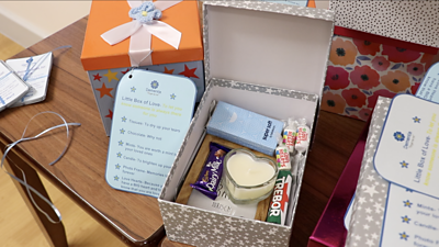 The boxes are given to families to support them while caring for someone with dementia.