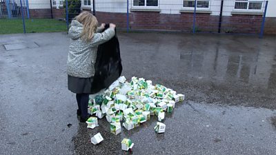children emptying waste bags