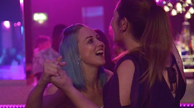 Lynn (Roxanne Scrimshaw) and Lucy (Nichola Burley) dance in a nightclub