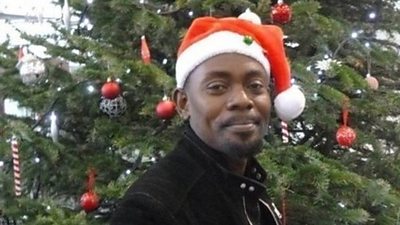 man wearing Christmas hat