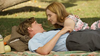 Saoirse Ronan looks lovingly at Billy Howle on a picnic.