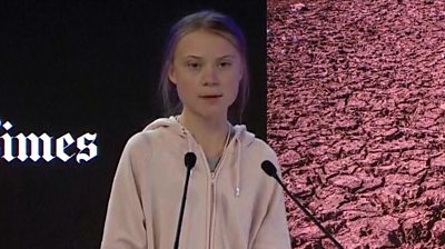 Greta Thunberg speaking at Davos on stage.