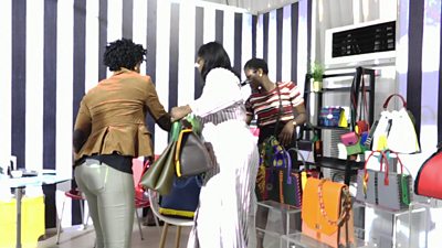 Women buying leather handbags in Lagos, Nigeria