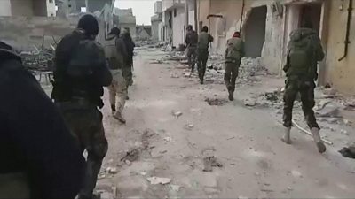 Syrian government troops patrol Maarat al-Numan