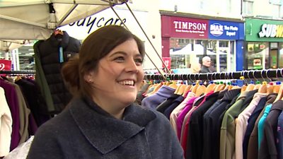 Woman at a clothes stall