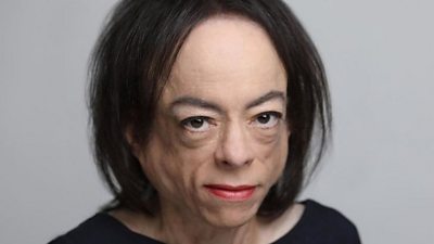 Mid-shot portrait of Liz Carr looking into camera