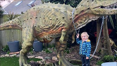 A boy and dinosaur