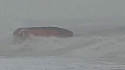 Hastings lifeboat nearly capsizes