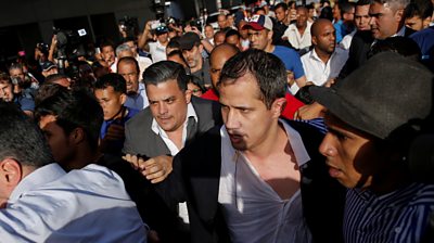 Juan Guaidó amid a crowd at the airport after arriving back in Venezuela
