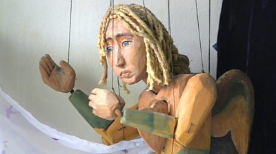 a wooden puppet