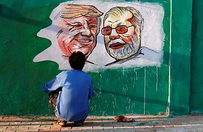 President Trump and PM Modi's face painted on a wall