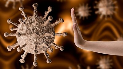 Hand pushing away coronavirus