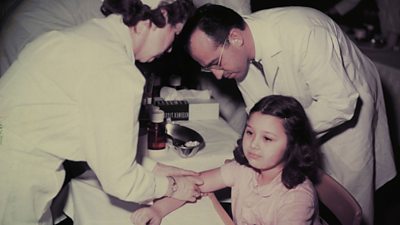 Child receiving the polio vaccine from Dr Jonas Salk