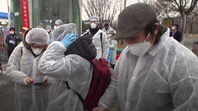 People in protective clothing