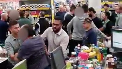 Shoppers fighting in supermarket