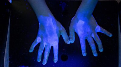 Hands under UV light