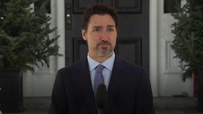 Canadian PM Justin Trudeau pauses Covid-19 speech to bundle up