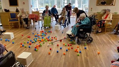 Care home residents play Hungry Hungry Hippos