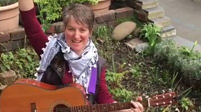 Sheffield musicians play in gardens to raise community spirits.