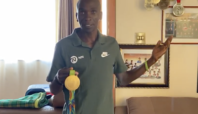Eliud Kipchoge with his gold medal from Rio 2016