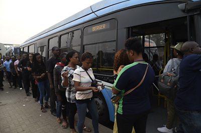 People boarding a bus in Lagos