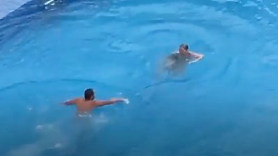 Video shows police removing councillor Joanne Rust from a swimming pool after she refused to leave.