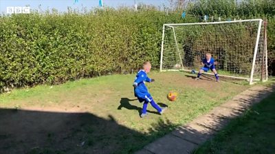 Brothers Callum and Liam playing football