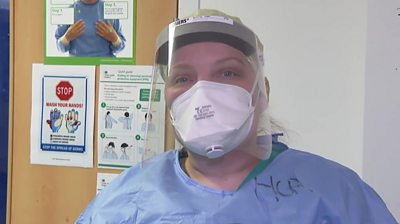 Staff at Addenbrooke's Hospital show how much protective clothing is needed to work in intensive care.