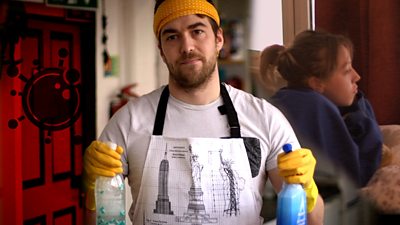 Man with cleaning bottles