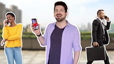 Chris Fox holding a smartphone