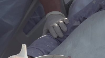 A hand on a patient