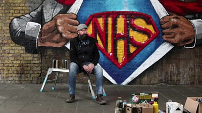 Artist Lionel Stanhope infront of finished mural